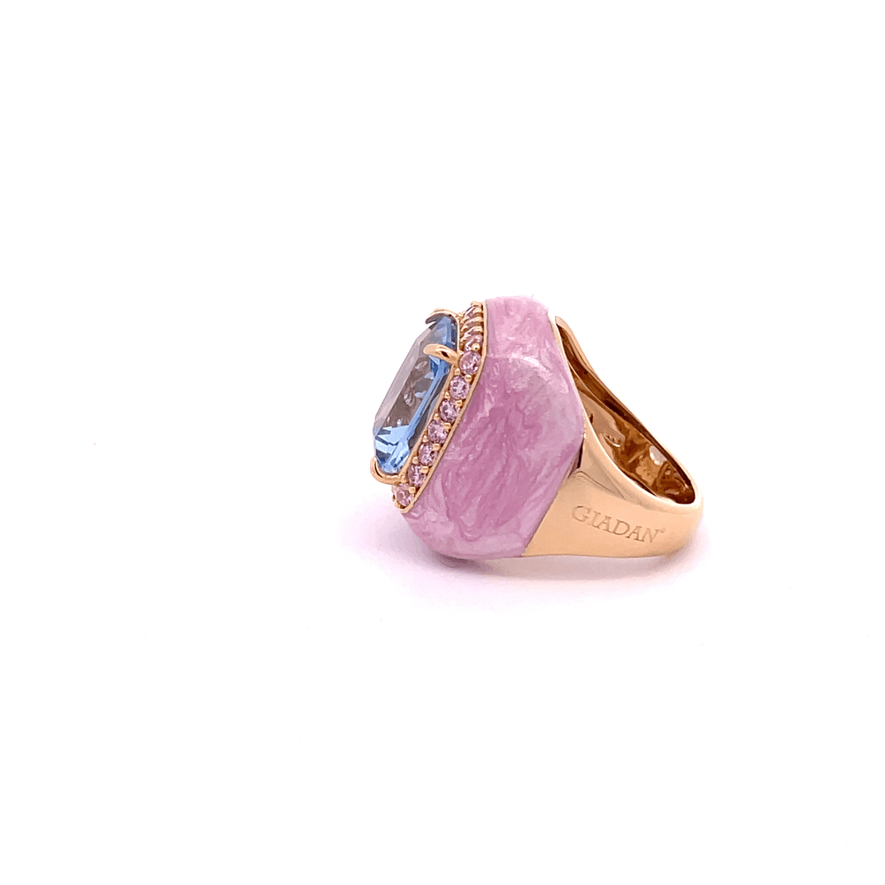 JULIA statement ring, pink marbled enamel band with light blue center stone and champagne zirconia halo, side view showing GIADAN stamp