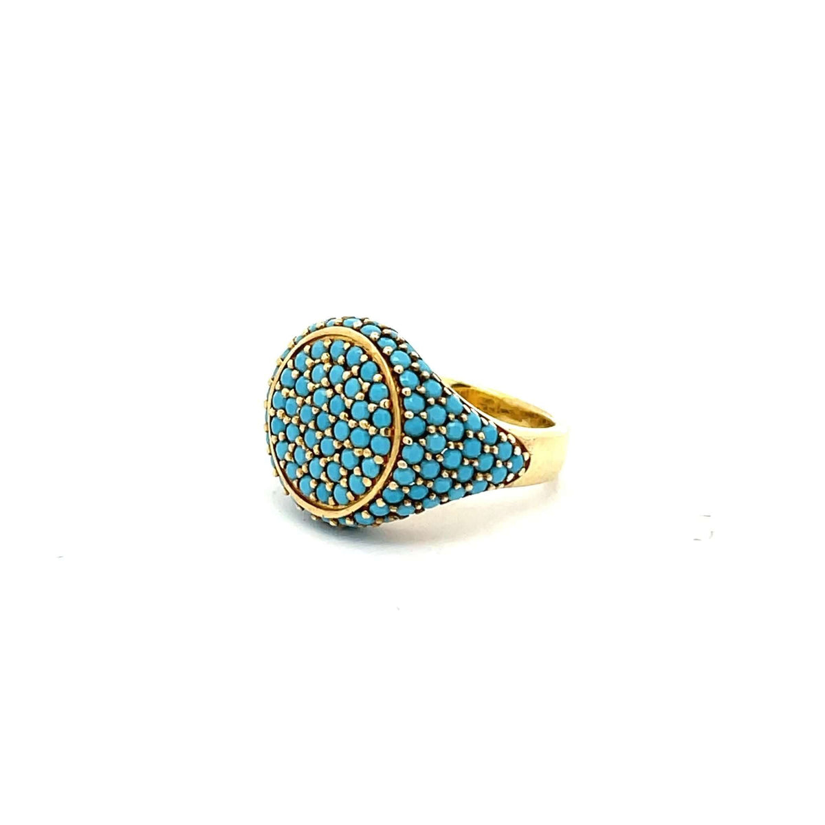Angled view of GRACE - TURQUOISE by Giadan, yellow gold plated pavé pinky ring with turquoise zirconias