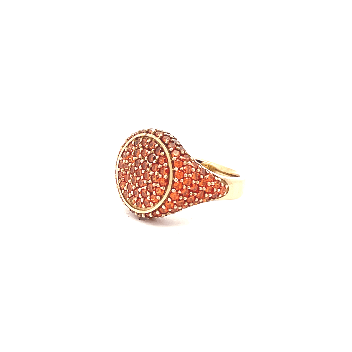 Gold plated ring with orange pavé-set zirconias on a white background, side view