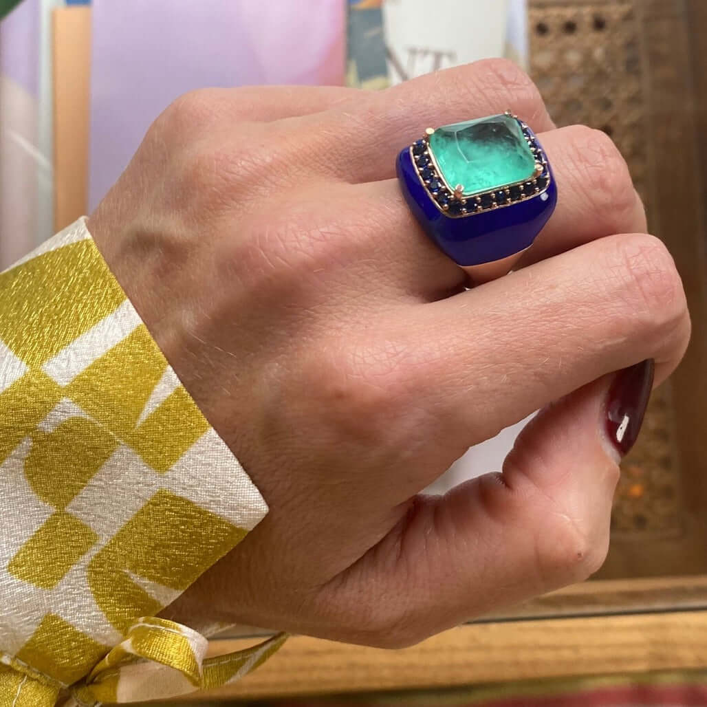 LAILA statement ring, cobalt blue enamel band with aquamarine green center stone, worn on hand. GIADAN for Le.Paul Jewelgarden