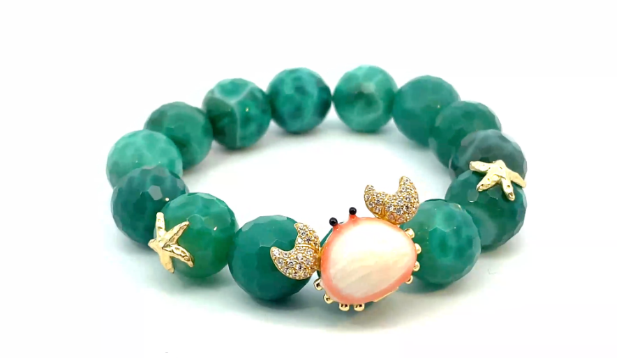 Green, beaded statement bracelt with Crab and starfish motifs from Misis for Le.Paul