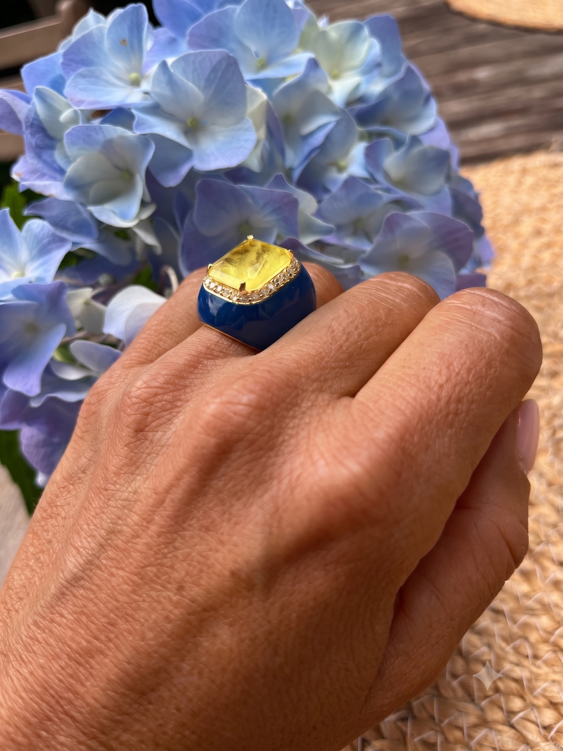 Orguyo ring by Giadan for Le.Paul Jewelgarden — deep blue enamel statement ring with yellow doublette center stone worn on hand
