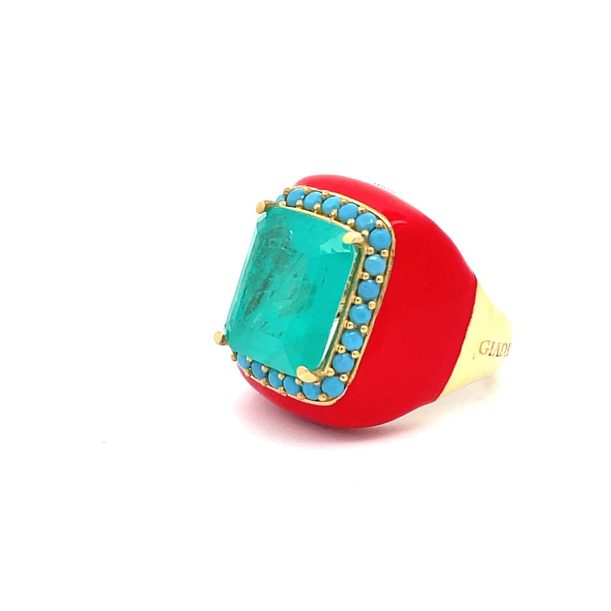 Yellow gold plated statement ring with Ferrari red enamel, turquoise blue doublette center stone and turquoise blue pavé zirconias seen from the side.