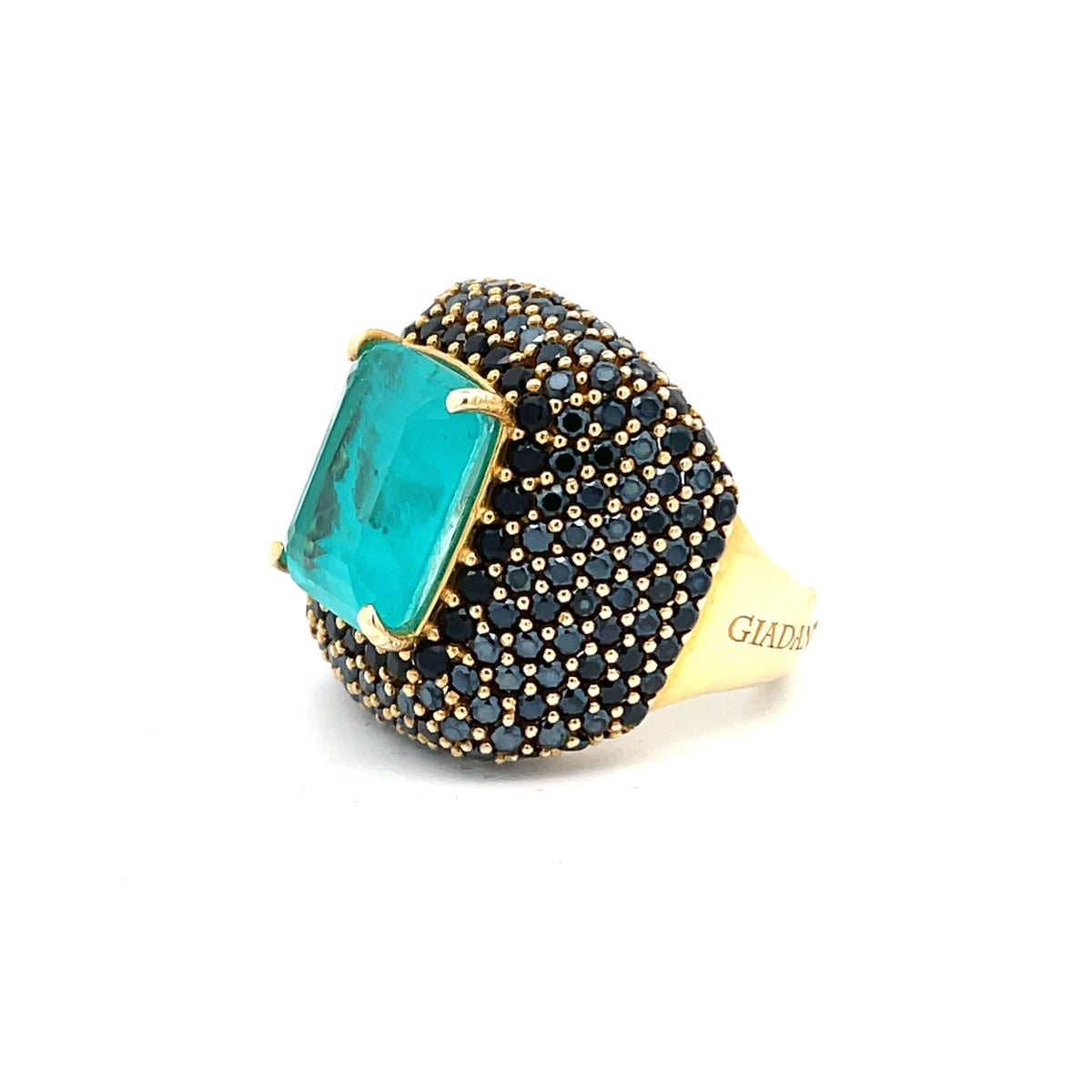 Angled view showing volume of yellow gold plated statement ring with aquamarine green doublette center stone and black zirconias — YVES by Giadan for Le.Paul Jewelgarden