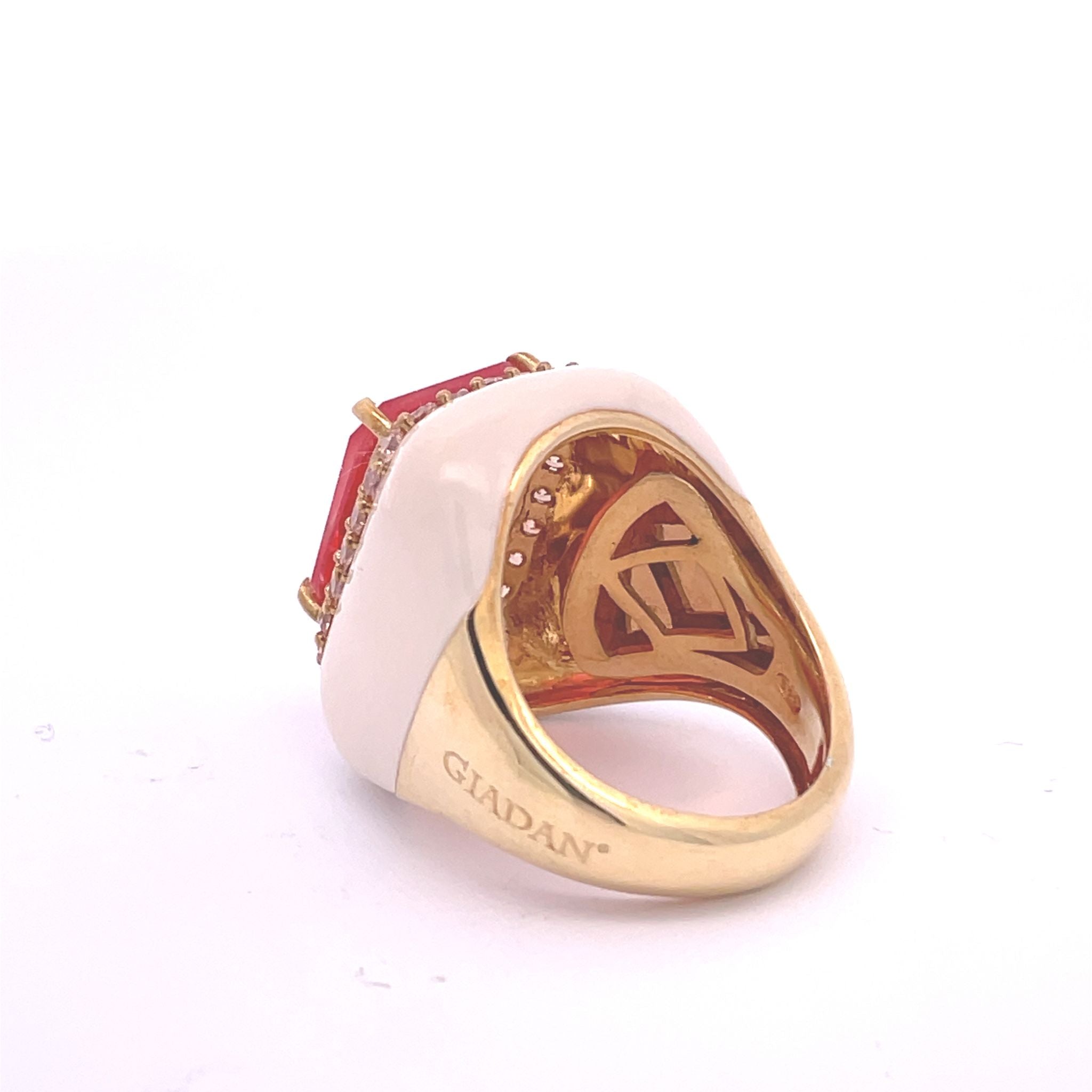 Yellow gold plated statement ring with light ivory enamel, orange doublette center stone and champagne pavé zirconias. With size-adjusting system visible.