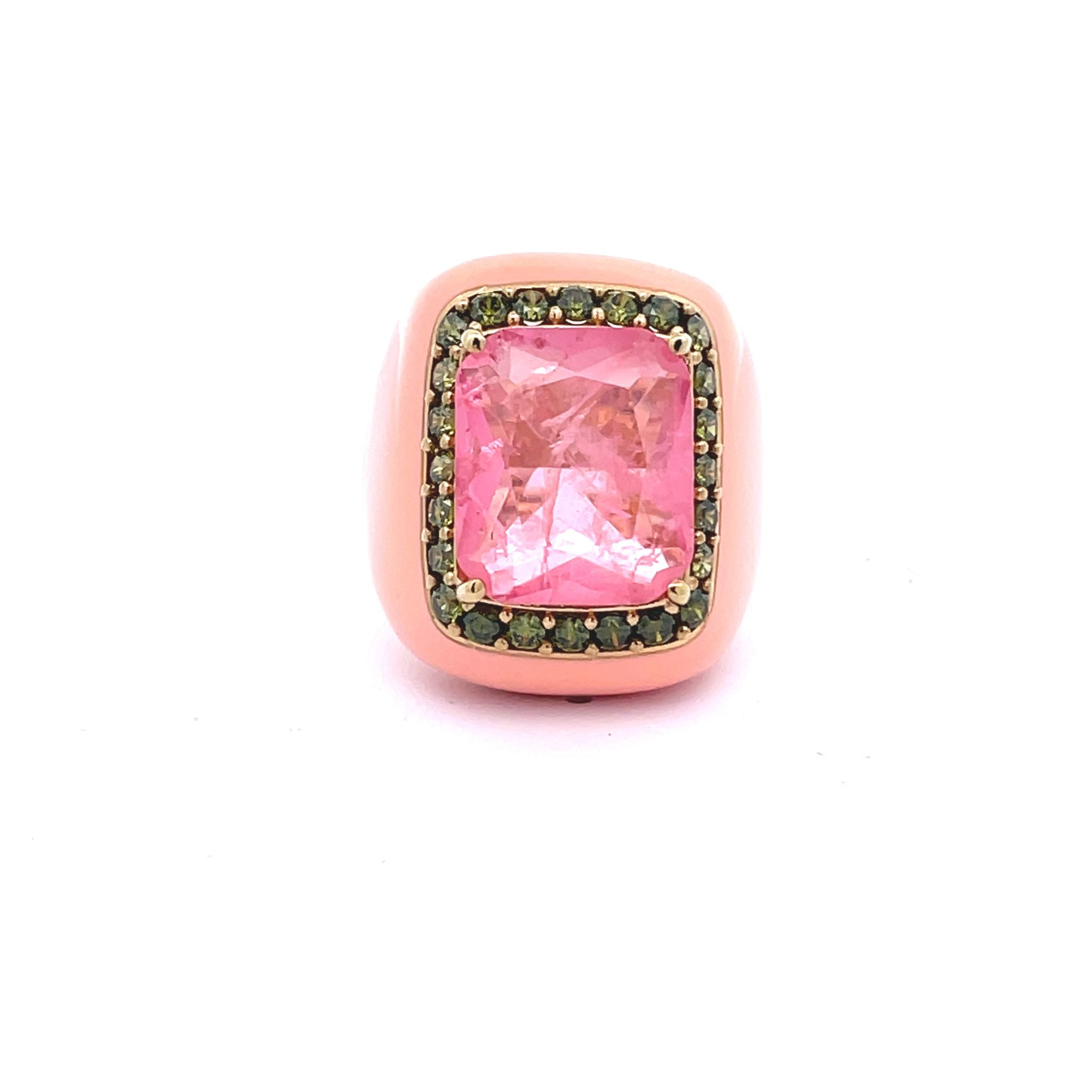 Yellow gold plated statement ring with peach pink enamel, pink doublette center stone and peridot green pavé zirconias, top view. 