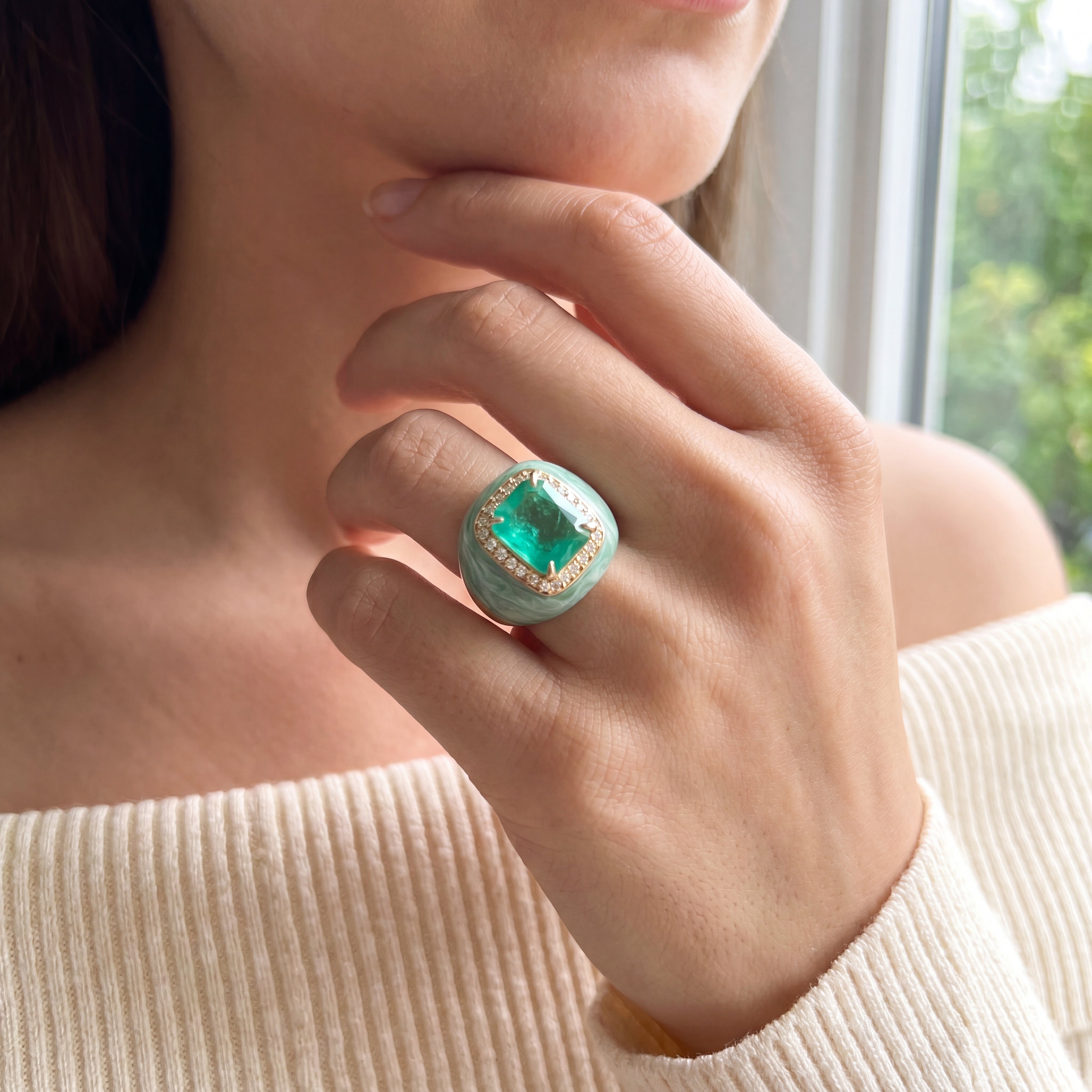 VALENTINA statement ring worn on a hand, aqua green center stone with marbled light green enamel and champagne pavé, yellow gold plated. GIADAN for Le.Paul Jewelgarden